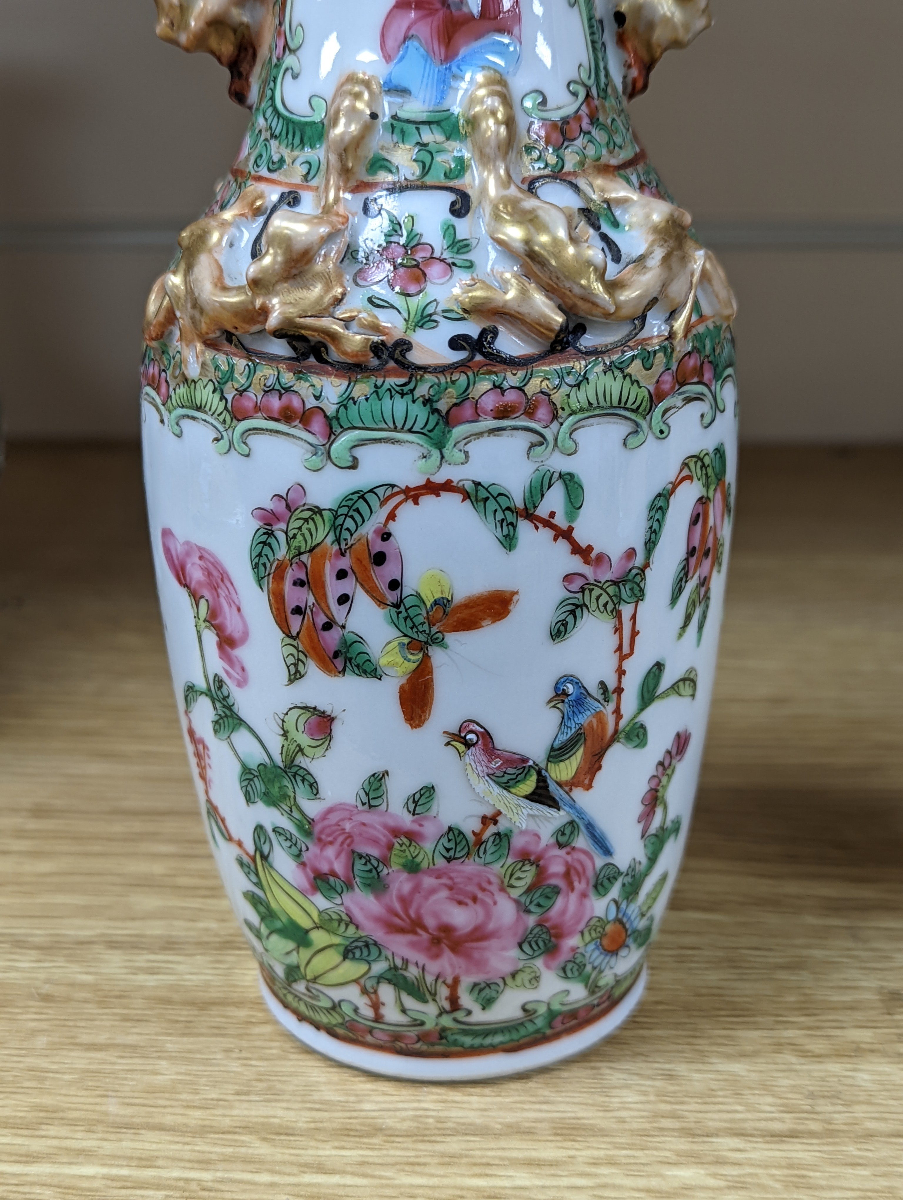 Four 19th century Chinese famille rose vases, 21cm